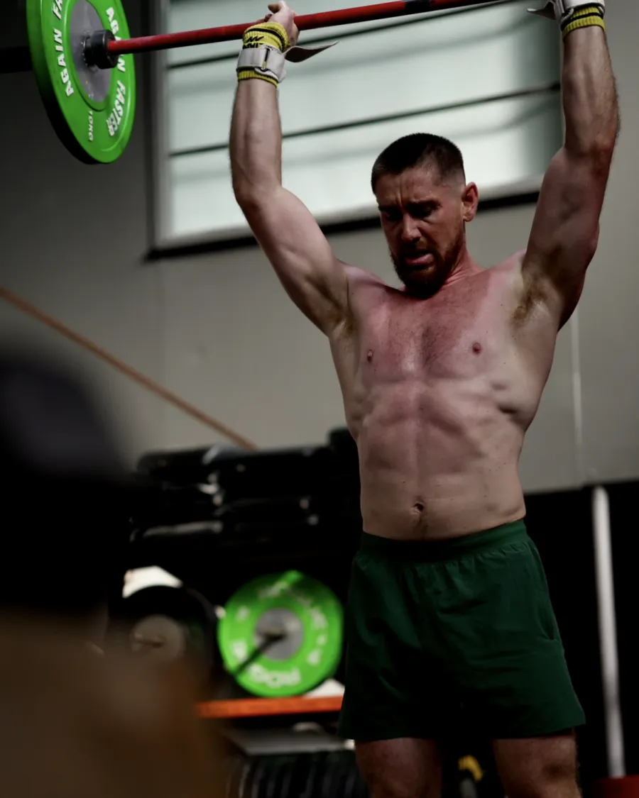 Matt performing an overhead lift at CrossFit Brisbane